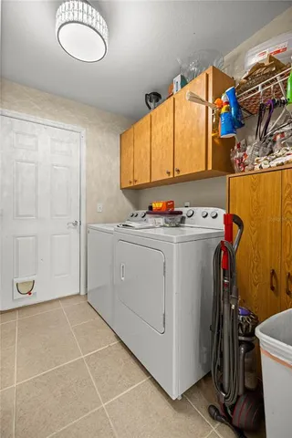 a view of a storage & utility room with washer and dryer