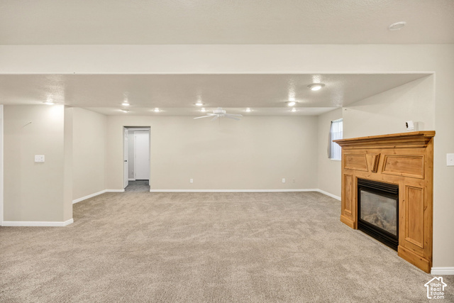 1143 East Mountain Road Logan, UT 84321 - Photo 27 of 64 Recessed lighting and a ceiling fan illuminate the carpeted area