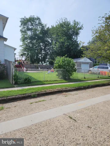 a view of a golf course with a road