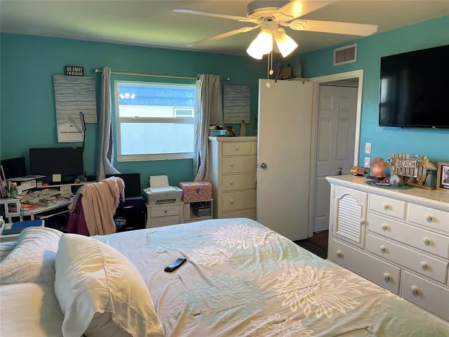 a view of kitchen with cabinets and flat screen tv