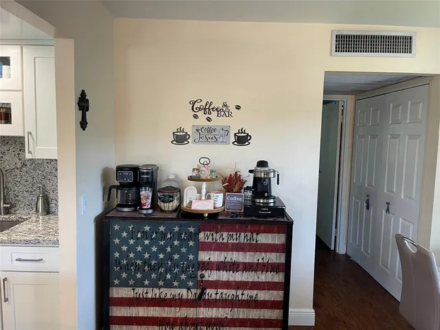 a table with wine bottles and sink