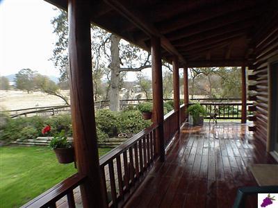 13794 Millerton Road Prather, CA 93651 - Photo 5 of 14 Private rear deck looks upon your acreage and seasonal stream deck wraps around entire home.