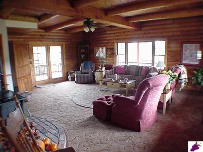 13794 Millerton Road Prather, CA 93651 - Photo 8 of 14 Roomy Family Room with lots of warmth and windows looking out to pasture