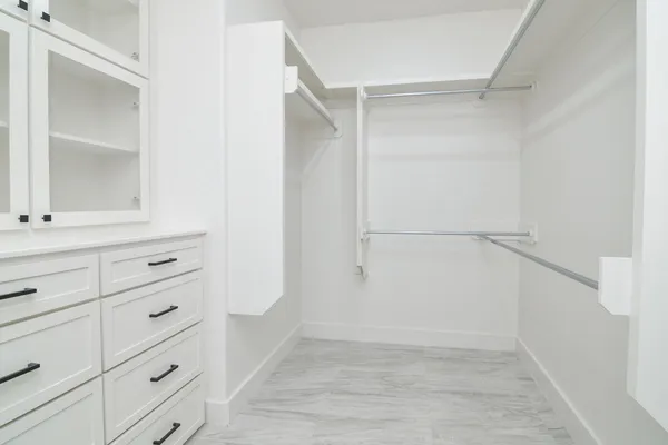 a view of an empty walk in closet