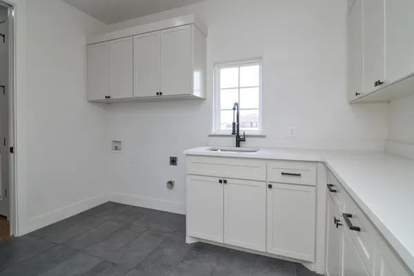 a bathroom with a sink and cabinets