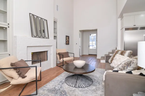 a living room with furniture and a fireplace