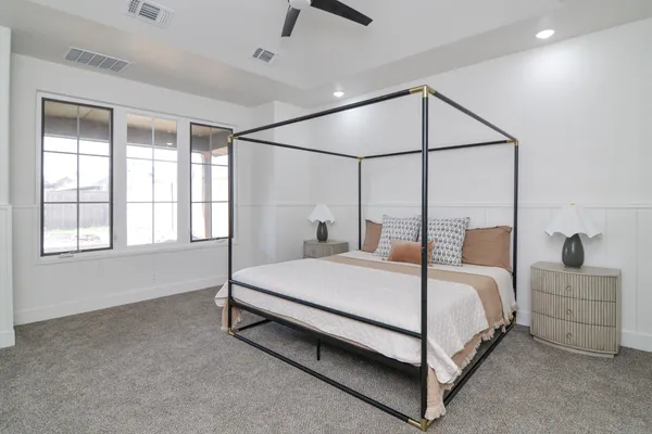 a bedroom with a bed and window