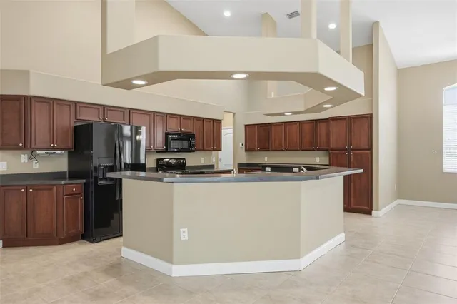 a bedroom with a bed and a flat screen television