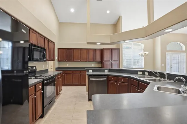 a spacious bathroom with a tub double sink and mirror