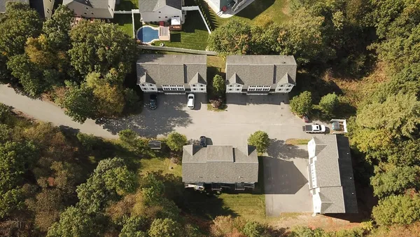 an aerial view of a house having yard