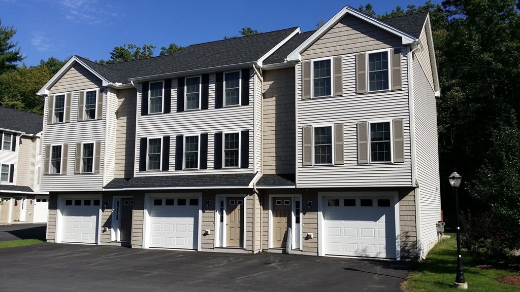 5 Bufton Farm Road, Unit 7 Clinton, MA 01510 - Photo 5 of 22 a front view of residential houses