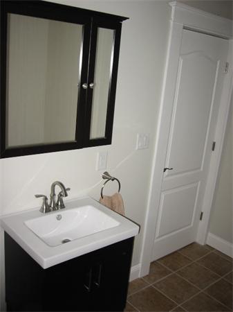 4 Spring Lane Stoneham, MA 02180 - Photo 11 of 13 a bathroom with a sink and a mirror