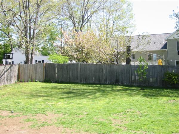 4 Spring Lane Stoneham, MA 02180 - Photo 13 of 13 a garden with wooden fence