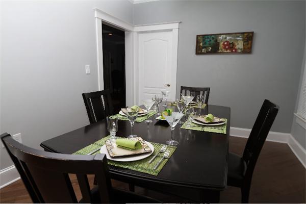 4 Spring Lane Stoneham, MA 02180 - Photo 7 of 13 a view of a dining room with furniture and wooden floor