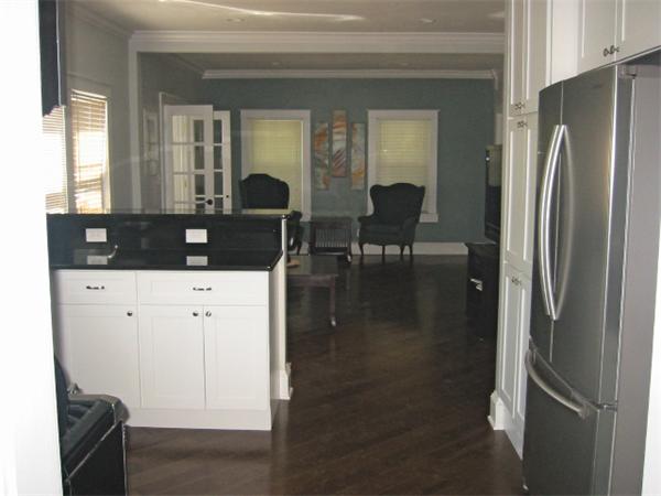 4 Spring Lane Stoneham, MA 02180 - Photo 9 of 13 a kitchen with stainless steel appliances granite countertop a refrigerator and a stove