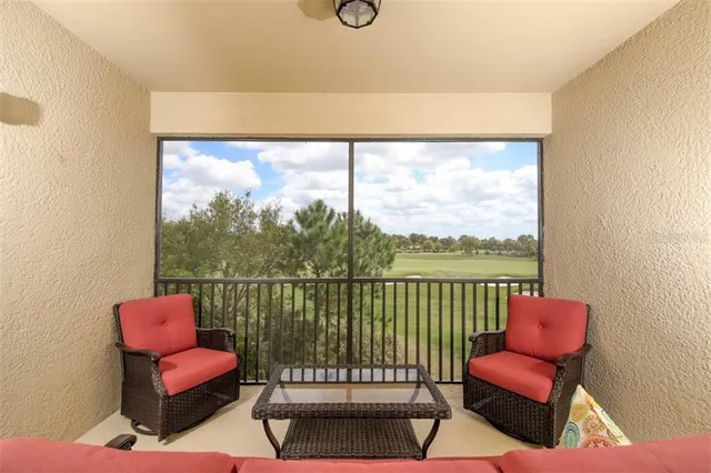 a view of a living room with furniture and a chair