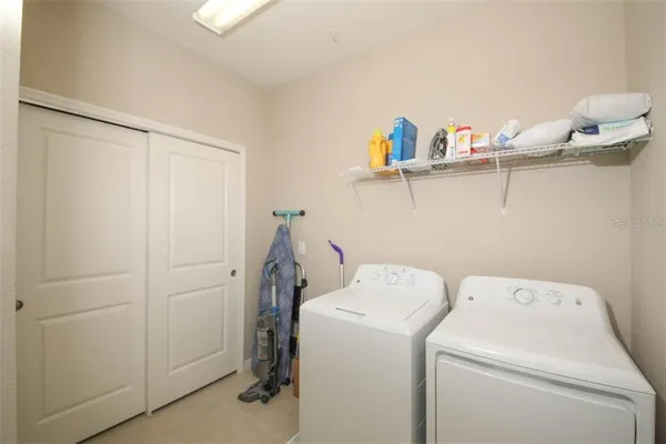 a view of storage and utility room with washer and dryer