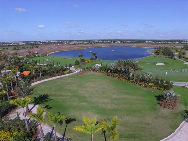 a view of a lake with a yard