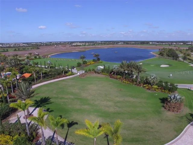 a view of a lake with a yard