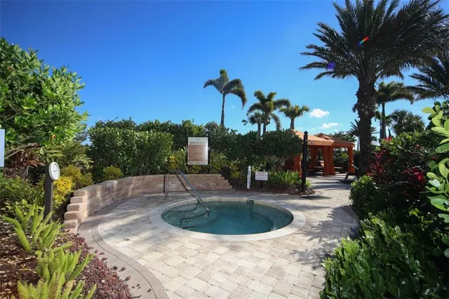 a view of a swimming pool with a table and chairs
