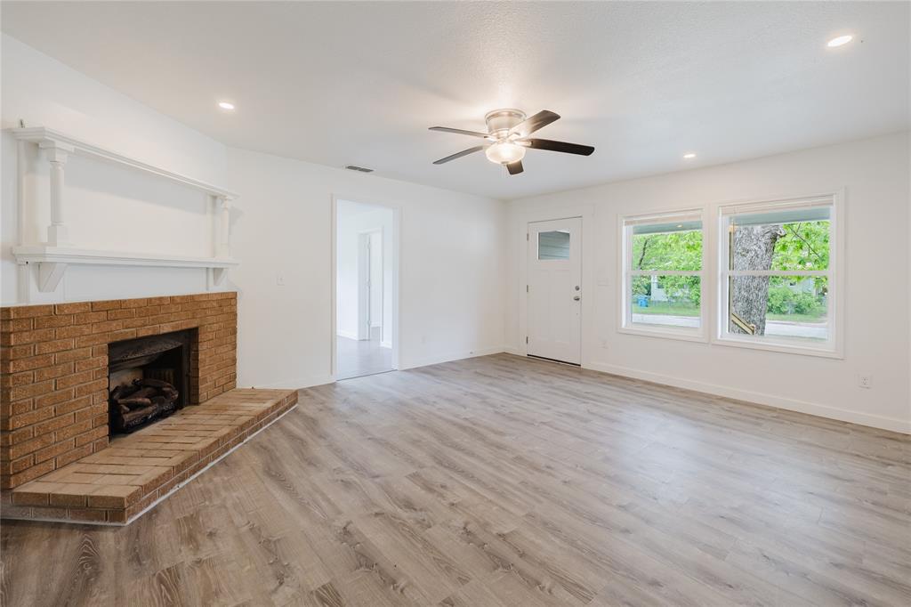 524 West Roberts Street Gorman, TX 76454 - Photo 8 of 35 a view of empty room with wooden floor and fan