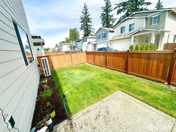 a view of a garden with houses