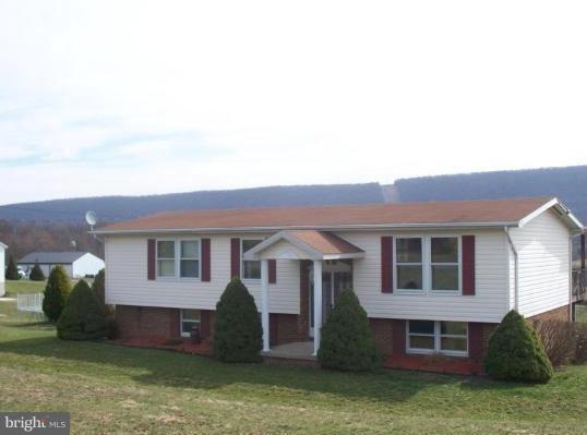 3932 Highland Ridge Road Berkeley Springs, WV 25411 - Photo 1 of 30 a house view with a garden space