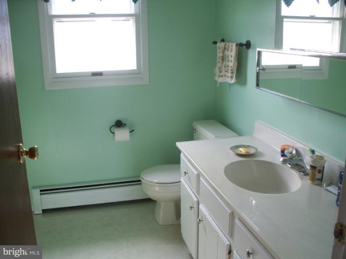 3932 Highland Ridge Road Berkeley Springs, WV 25411 - Photo 11 of 30 a view of a bathroom with a sink and a toilet