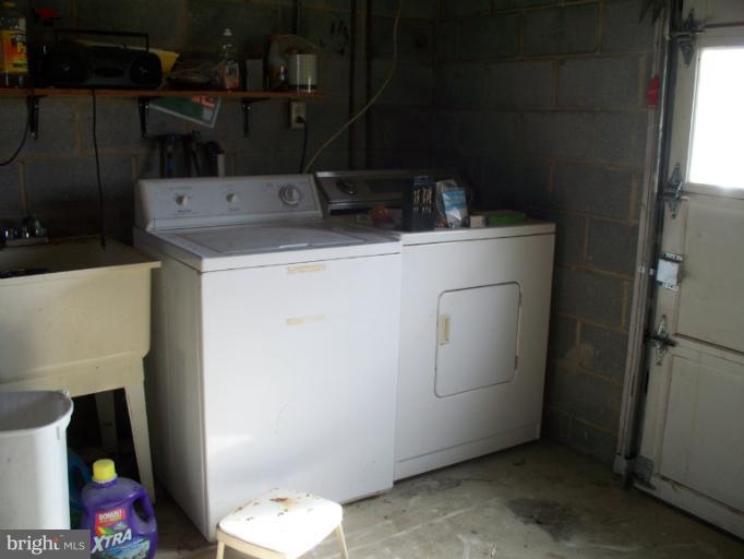 3932 Highland Ridge Road Berkeley Springs, WV 25411 - Photo 21 of 30 a utility room with dryer and washer