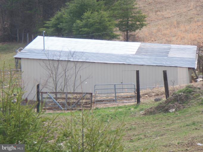 3932 Highland Ridge Road Berkeley Springs, WV 25411 - Photo 23 of 30 a view of a backyard