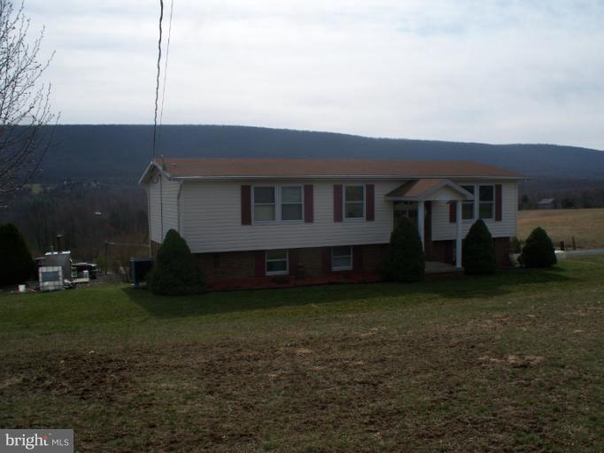 3932 Highland Ridge Road Berkeley Springs, WV 25411 - Photo 29 of 30 a view of a house with backyard