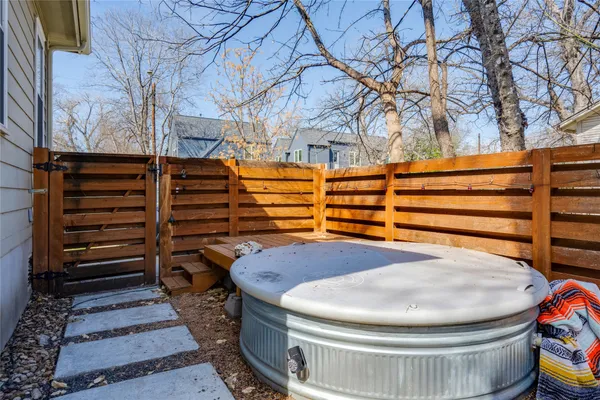 a bathroom with a toilet and a tub