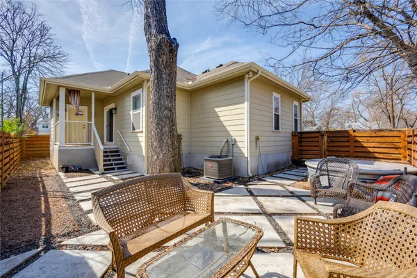 a view of backyard with a patio and outdoor seating