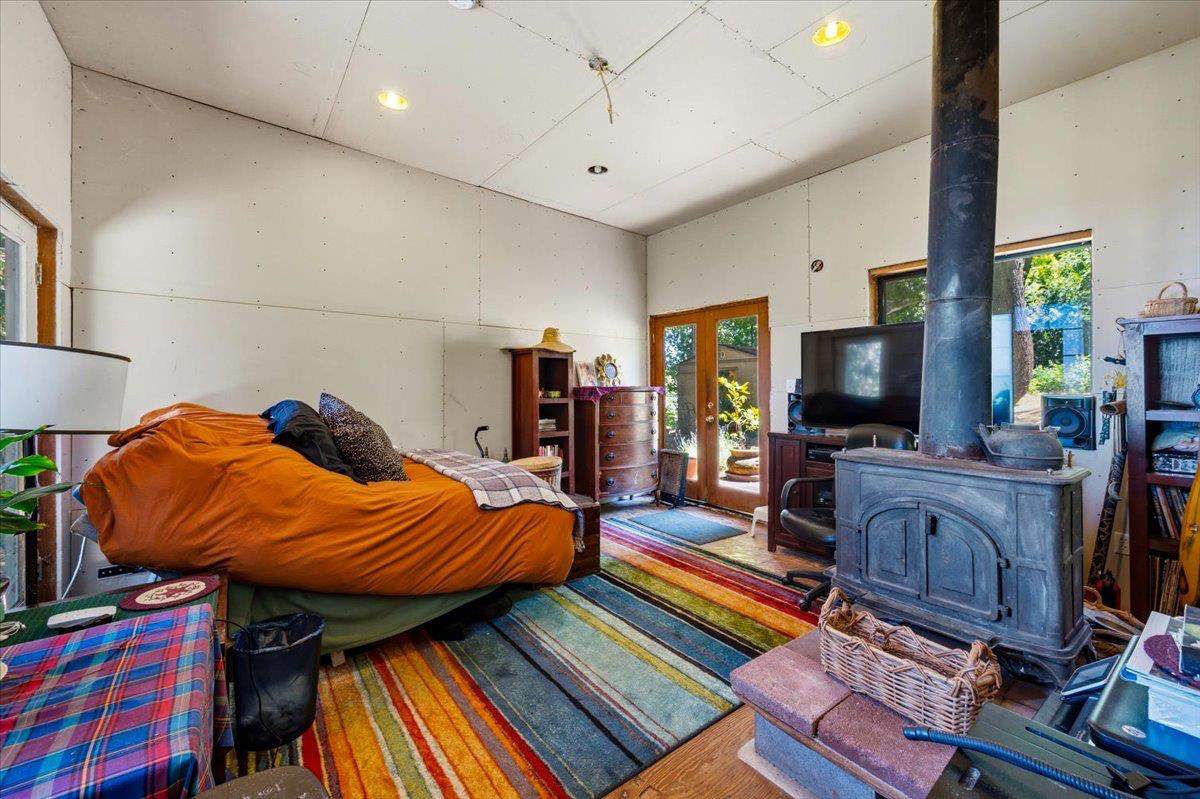 19643 Sages Road Nevada City, CA 95959 - Photo 6 of 39 a living room with furniture and a flat screen tv