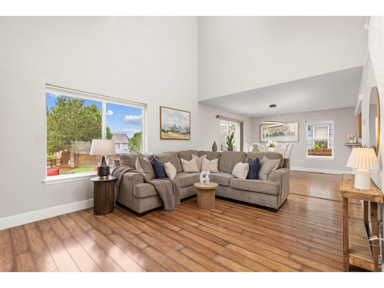 6531 St Vrain Ranch Boulevard Firestone, CO 80504 - Photo 5 of 30 a living room with furniture and a large window