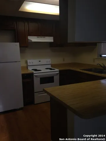 a kitchen with a stove and a microwave