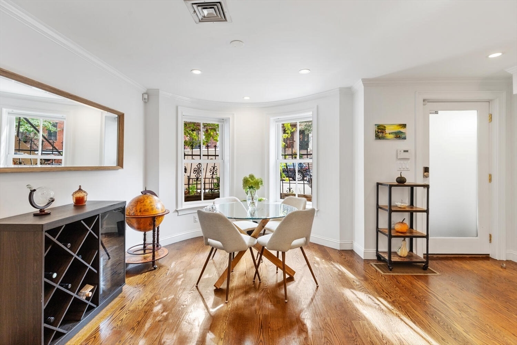 81 Appleton Street, Unit 1 Boston, MA 02116 - Photo 11 of 35 a view of a dining room with furniture window and wooden floor