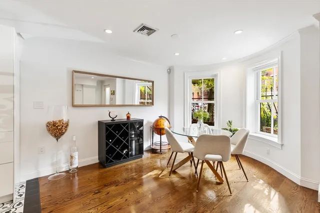 a view of a livingroom with furniture and a window