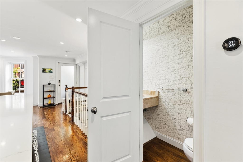 81 Appleton Street, Unit 1 Boston, MA 02116 - Photo 15 of 35 a view of a hallway with wooden floor and furniture