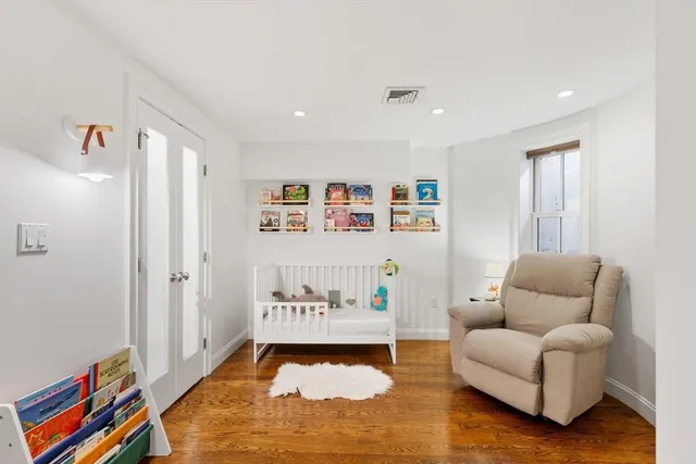 a living room with furniture and a rug
