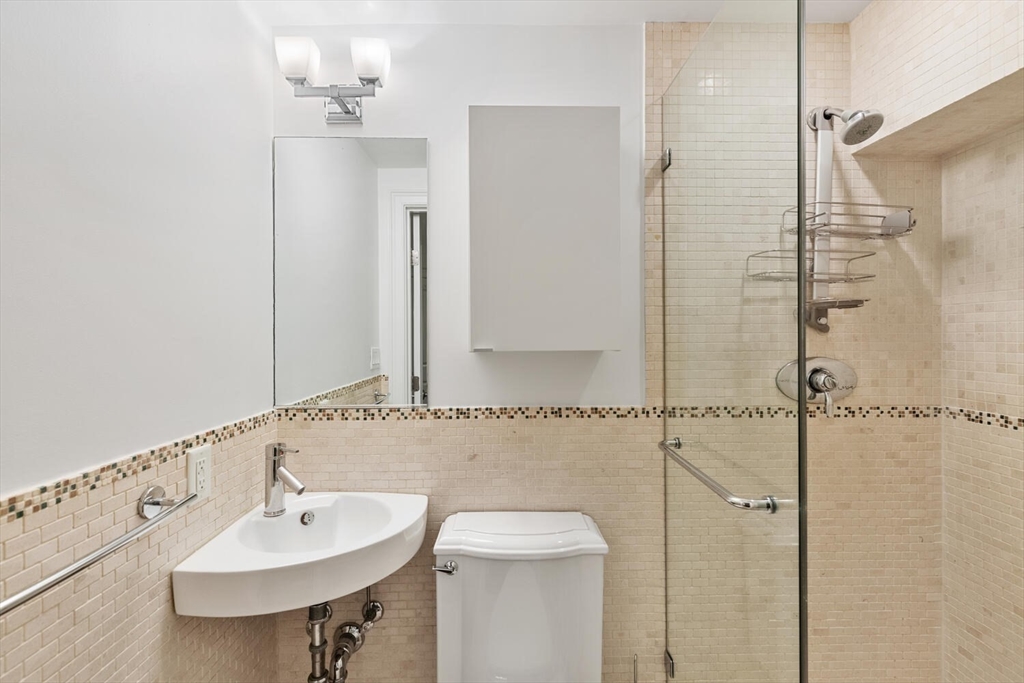 81 Appleton Street, Unit 1 Boston, MA 02116 - Photo 24 of 35 a bathroom with a sink and a mirror