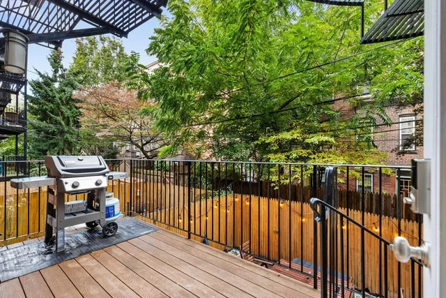 a view of a balcony with chairs