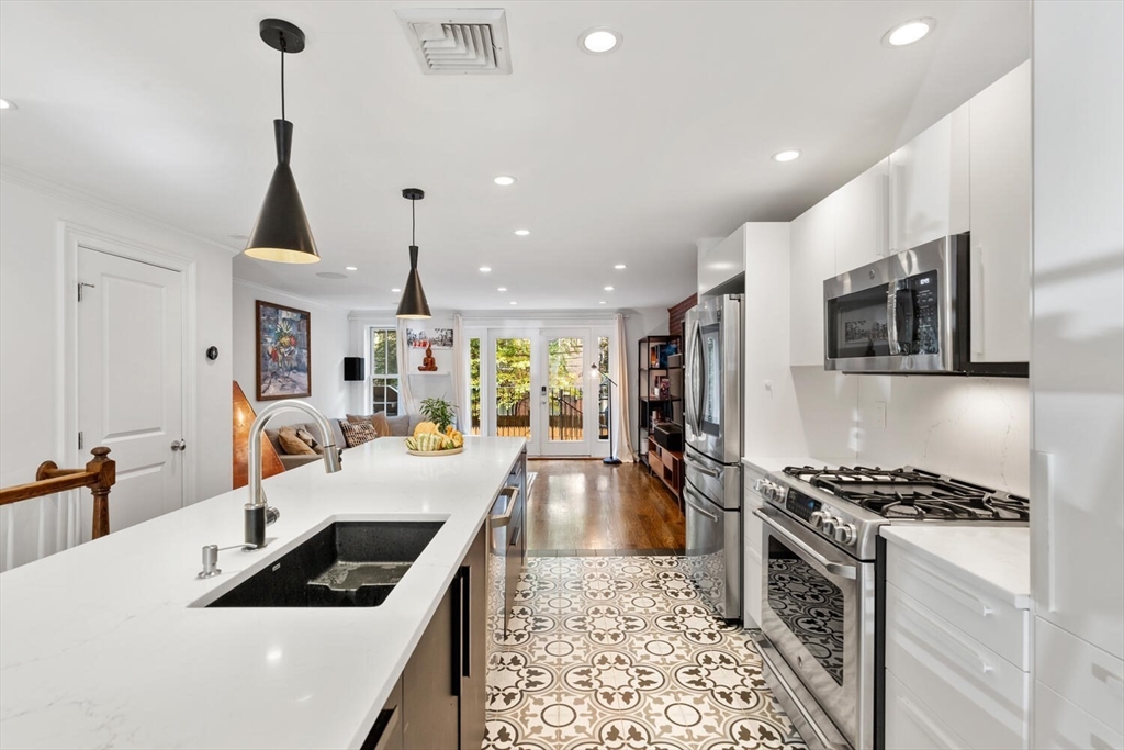 81 Appleton Street, Unit 1 Boston, MA 02116 - Photo 8 of 35 a large kitchen with sink a stove and cabinets