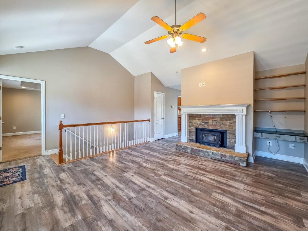 165 Horseshoe Bend Jasper, GA 30143 - Photo 9 of 44 a view of an empty room with a fireplace and a window