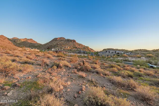 a view of a mountain range in a cloudy sky