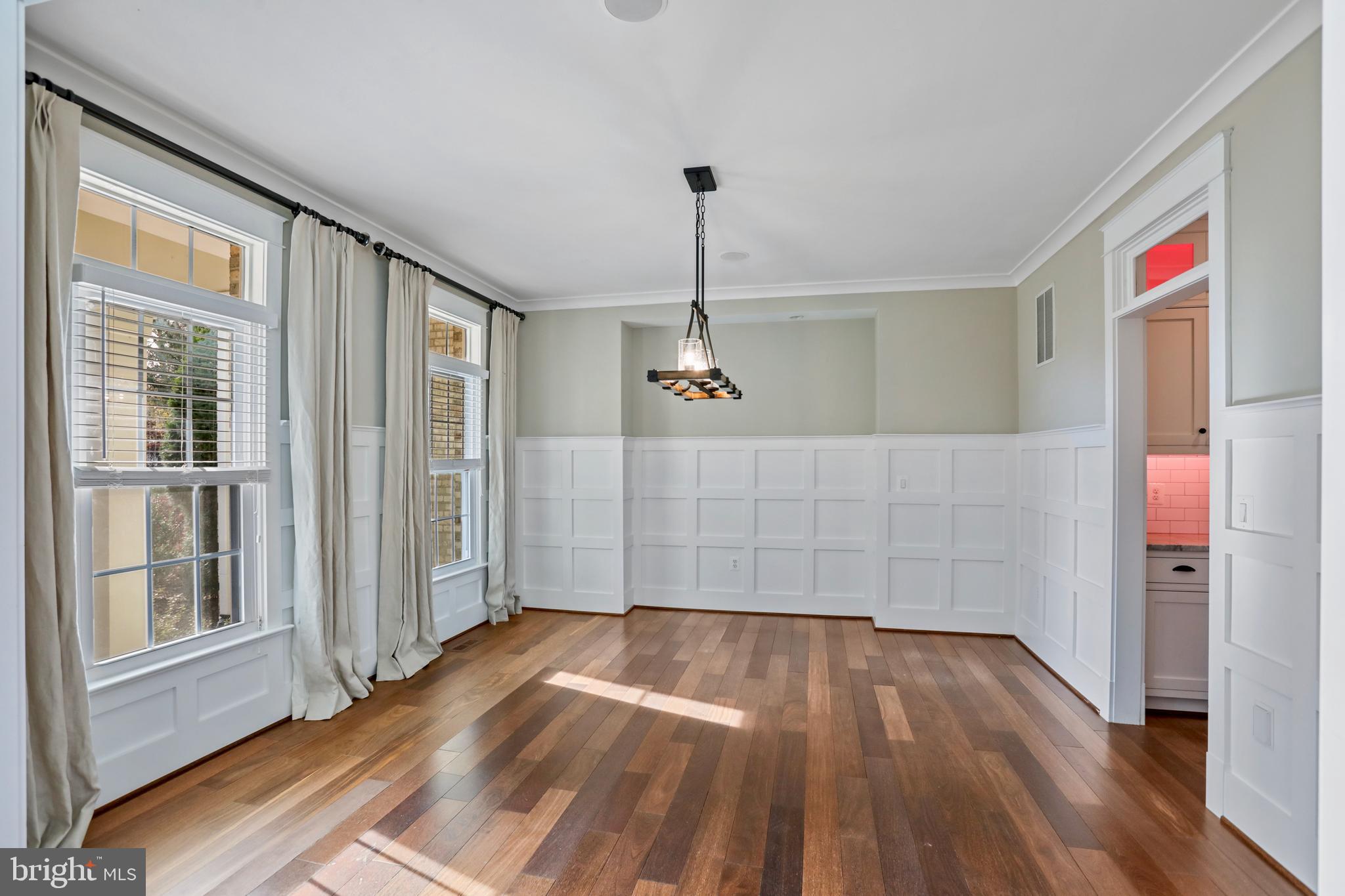 21490 Cedar Drive Sterling, VA 20164 - Photo 12 of 73 a view of an empty room with wooden floor and a window
