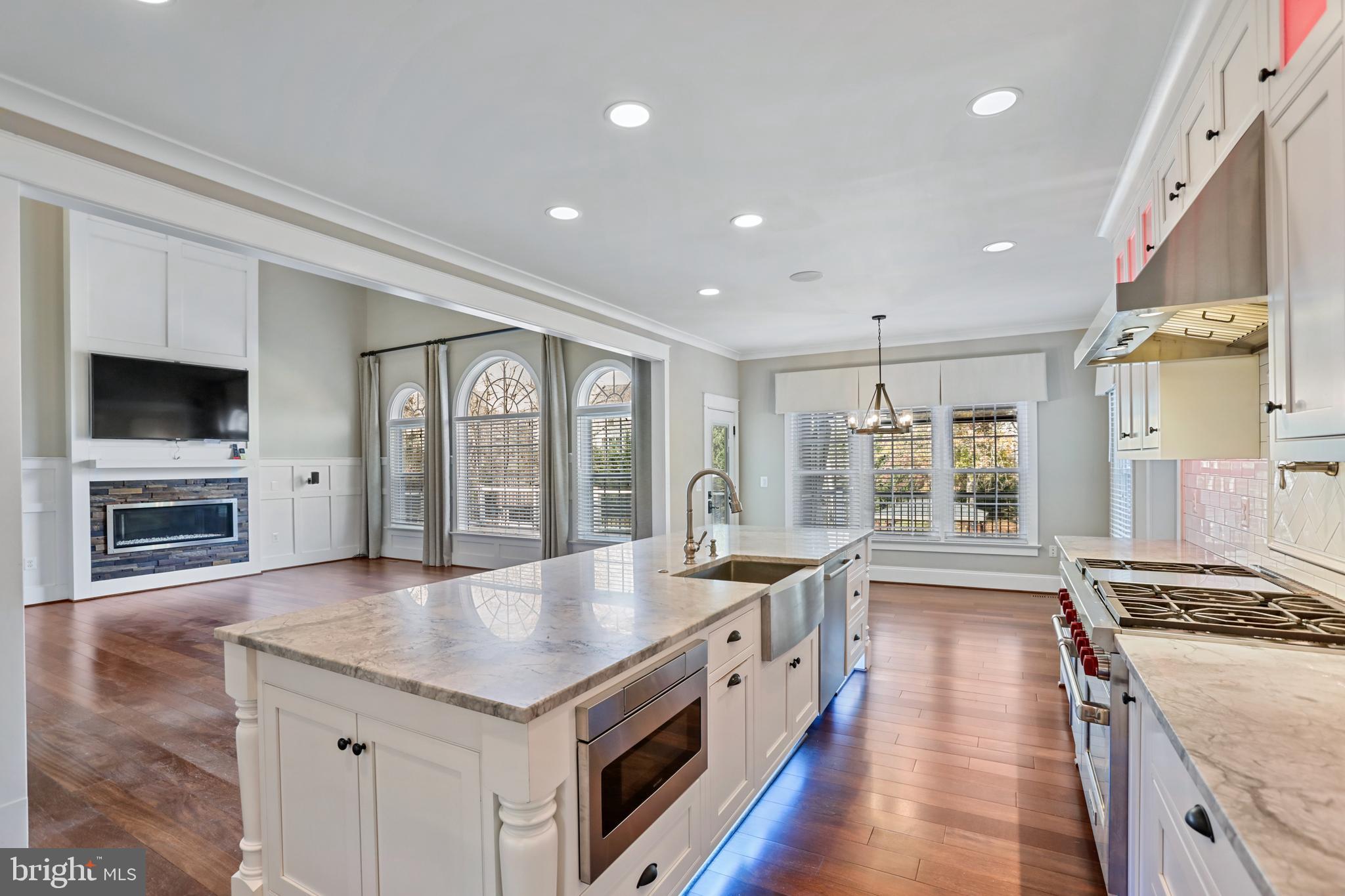 21490 Cedar Drive Sterling, VA 20164 - Photo 16 of 73 a large kitchen with stainless steel appliances granite countertop a large center island and a stove