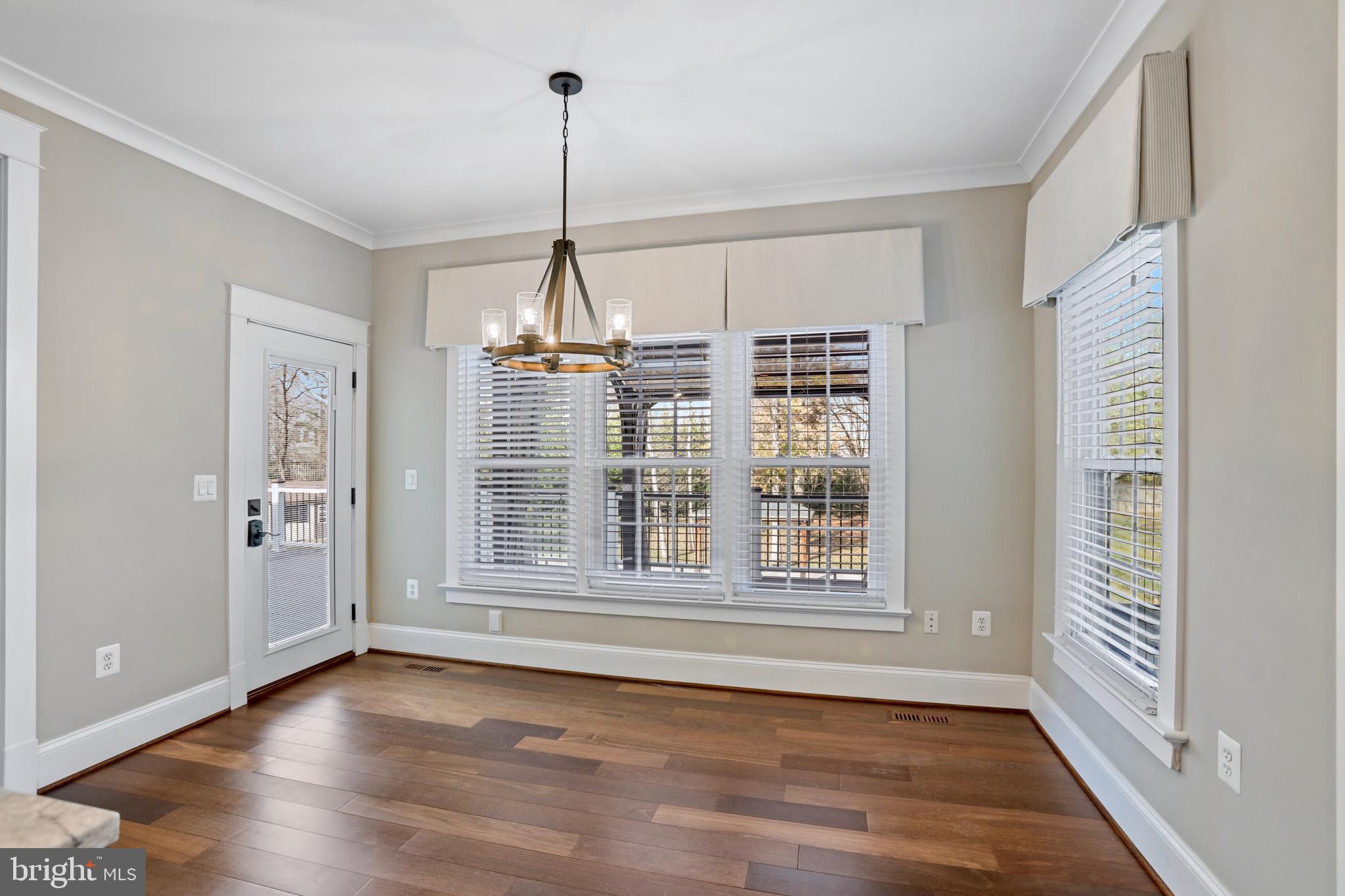 21490 Cedar Drive Sterling, VA 20164 - Photo 18 of 73 a view of an empty room with wooden floor and a window