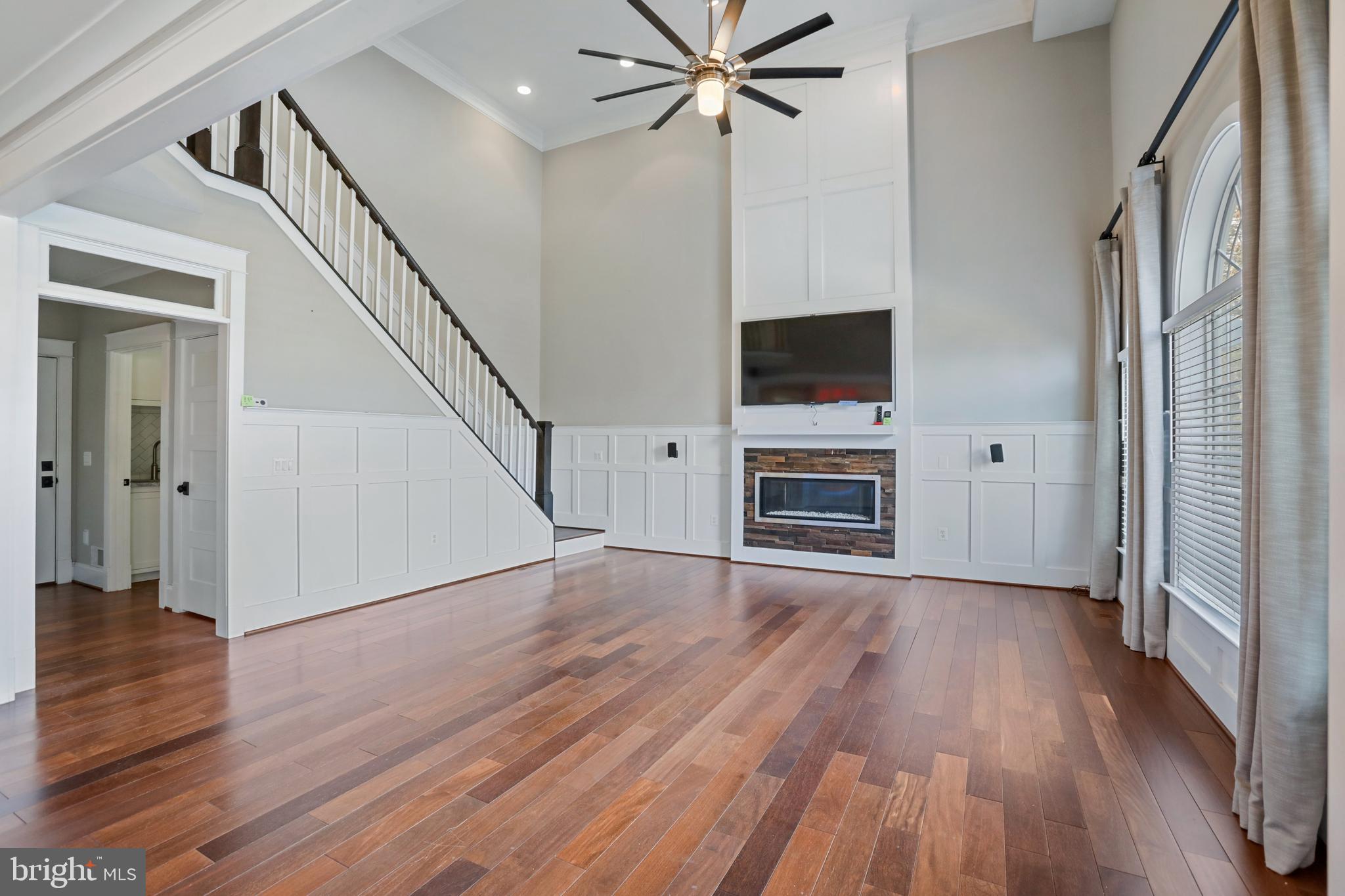 21490 Cedar Drive Sterling, VA 20164 - Photo 20 of 73 a view of a livingroom with wooden floor a ceiling fan and staircase