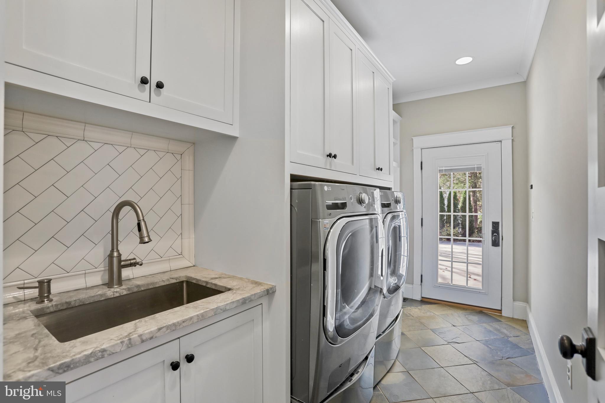 21490 Cedar Drive Sterling, VA 20164 - Photo 21 of 73 a view of a storage and utility room with a sink